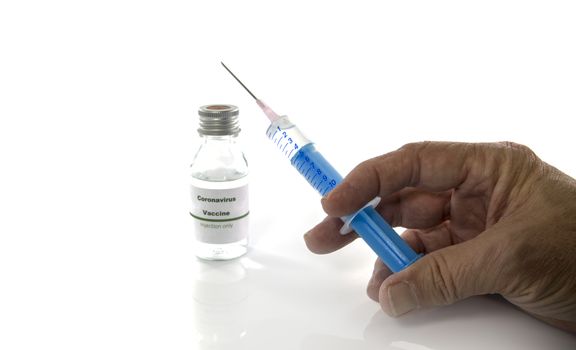 Coronavirus vaccine vial male hand holding injection syringe isolated on white background