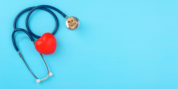 Doctor's Day concept, flat lay top view, stethoscope with red hearts diagnosis of heart disease on blue background with copy space for text