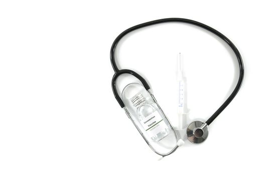 Coronavirus vaccine vial with injection syringe isolated and stethoscope on white background