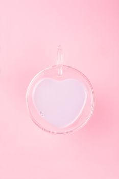 Heart shape love drink cup , latte coffee milk love potion milkshake concept on pink background with copy space for text