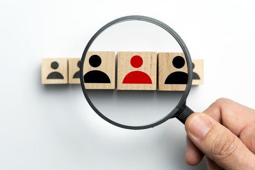 Searching for talent or looking for employee concept using magnifying glass and wooden cube with people icon