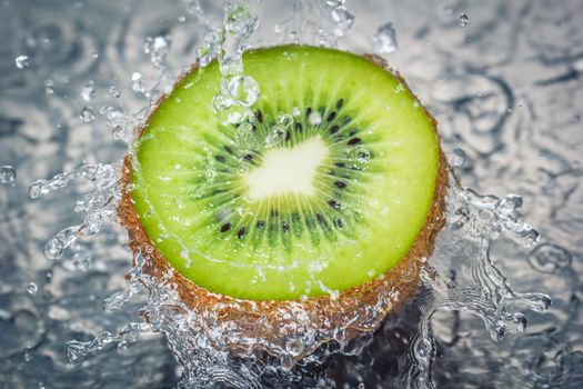 Kiwi fruit water splash - Concept of fresh tasty healthy fruit.