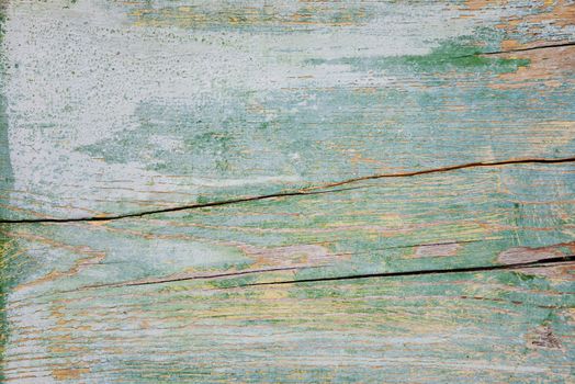 Abstract background of old peeled blue painted wooden boards