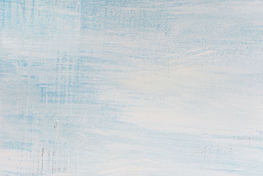 Wooden background painted with white and blue paint