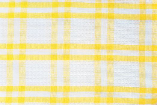 White and yellow checked cotton fabric texture closeup