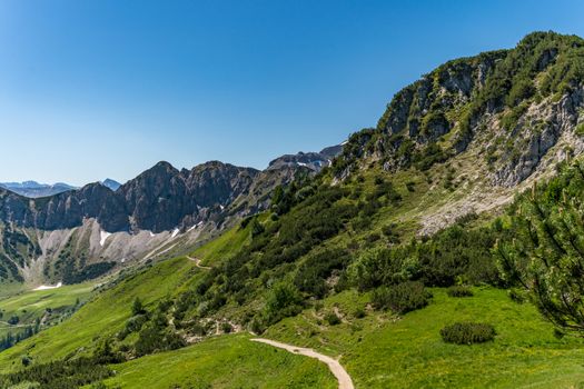 Fantastic hike in the Tannheim Mountains from the summit of Neunerkopfle over Landsberger hut to the beautiful Vilsalpsee.