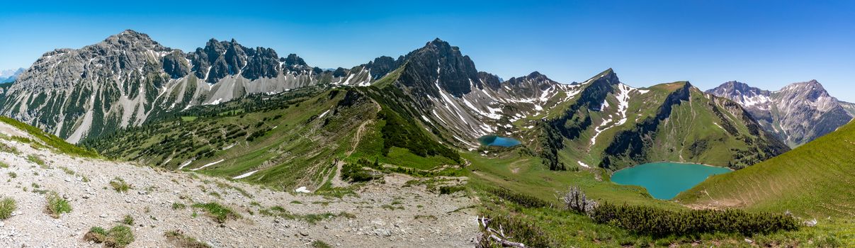 Fantastic hike in the Tannheim Mountains from the summit of Neunerkopfle over Landsberger hut to the beautiful Vilsalpsee.