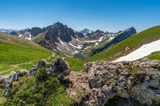 Fantastic hike in the Tannheim Mountains from the summit of Neunerkopfle over Landsberger hut to the beautiful Vilsalpsee.