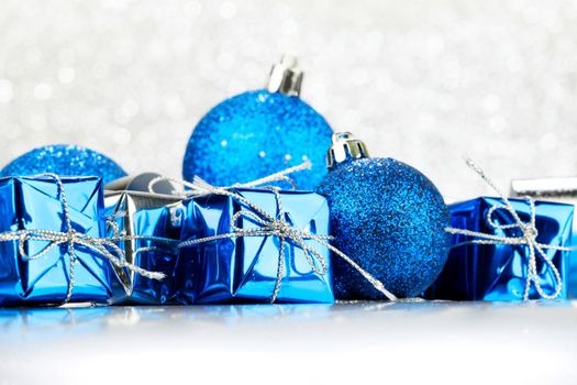 Christmas card with gifts and decorative balls close-up