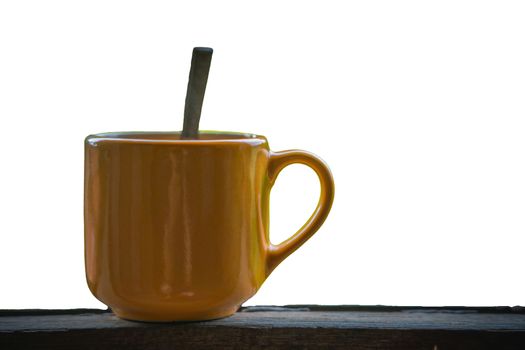 A Coffee cup on wooden table with white background