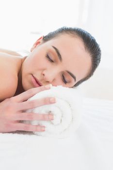 Close up of a beautiful young woman resting at beauty spa