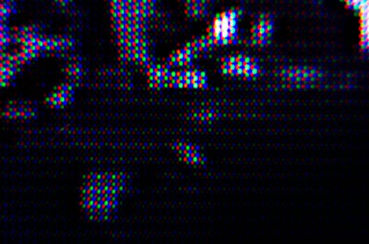 abstract background pattern of colored blurry dots on a dark background close up