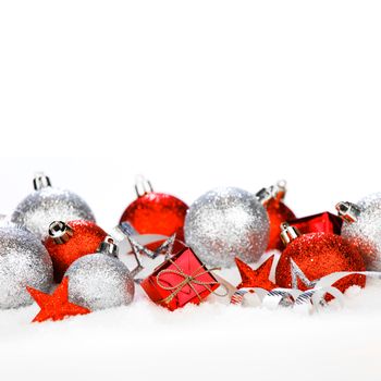 Christmas card with beautiful red and silver decorations in snow