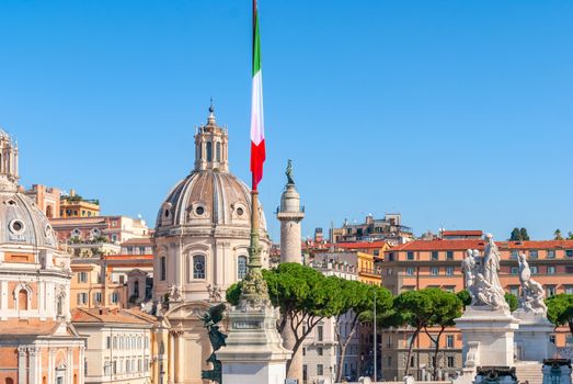 Italian flag in piazza Venezia, the central hub of Rome, Italy