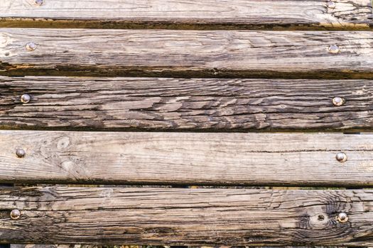 Wooden background in an old rustic style in brown color