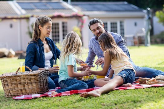 Happy family having a picnic in the garden