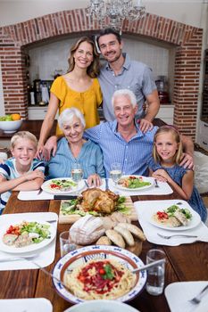 Portrait of multi-generation family having meal at home