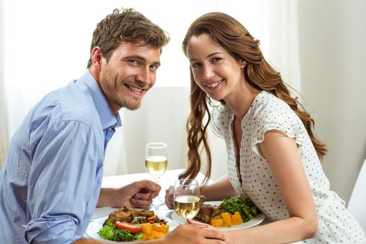 Portrait of romantic couple having lunch at home