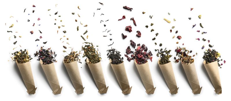 Large assortment of tea on a white background. The view from the top.