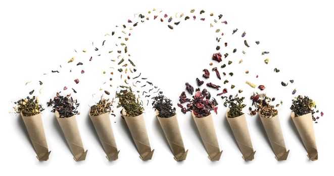 Large assortment of tea on a white background. The view from the top.