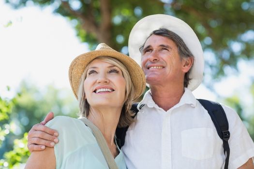 Happy couple on city break standing outdoors