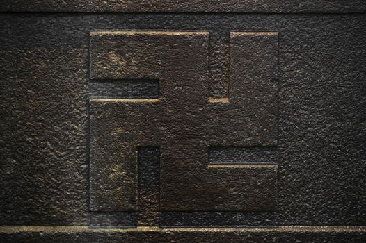 Temizuya "手水舎" stone adorned with the Buddhist swastika cross used for ablution of purification in the enclosure of Nezu shrine of the 18th century in Tokyo.