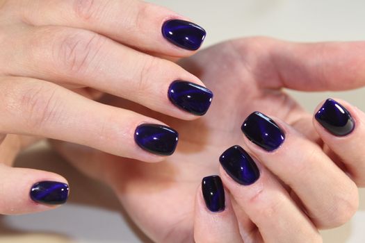 Beautiful manicure gel with cat lacquer eye