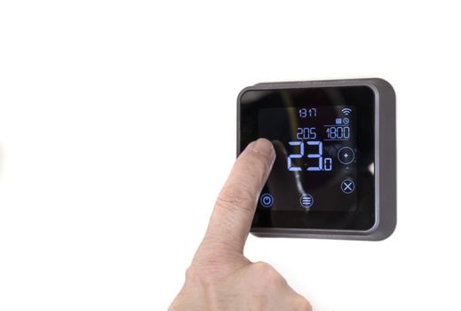 man lower the programmable digital  thermostat