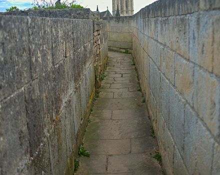 Stone pathway through fortress defensive wall at Caen, France