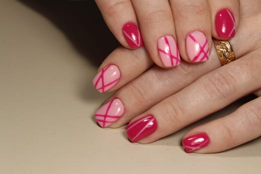 Manicured nails with pink nail polish. Manicure with nailpolish. Fashion art