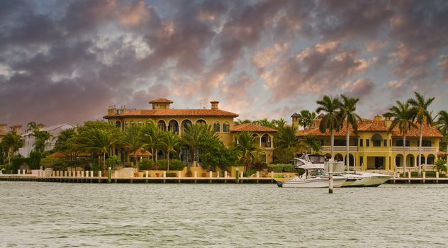 a Gold Stucco Mansion on a Canal