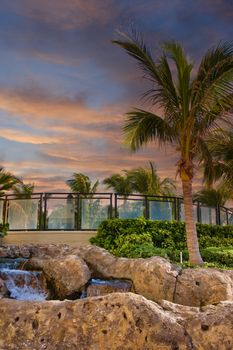Palm trees and fountains around a luxury hotel property