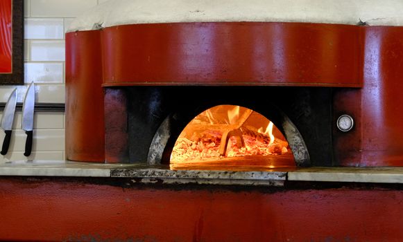 Fire Burning in a Red Red Pizza Oven