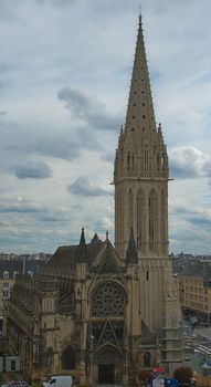 View from fortress on tall Catholic cathedral in Caen, France