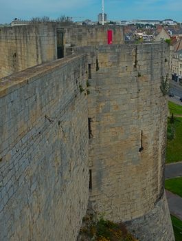 View on huge stone defensive wall and tower at Caen fortress, France