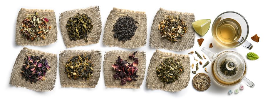 Large assortment of tea on a white background. The view from the top.