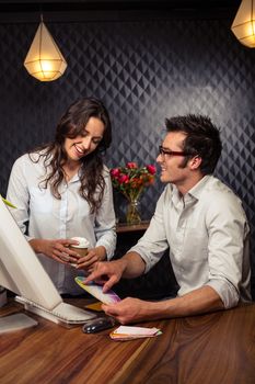 Creative business people working with colour samples in office