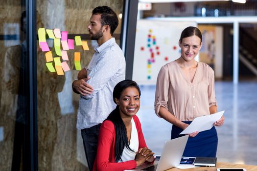 Team of colleagues at their desk in the office