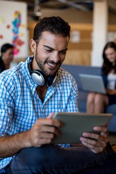 Young man using digital tablet in the office