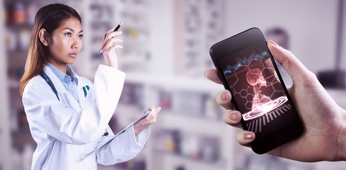 Asian doctor pointing with pen against medical interface in red and black