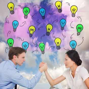 Business couple arm wrestling at desk against blue sky with white clouds