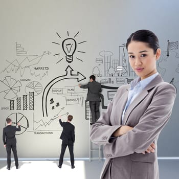 Portrait of a gorgeous businesswoman posing with the arms crossed against white background with spotlight