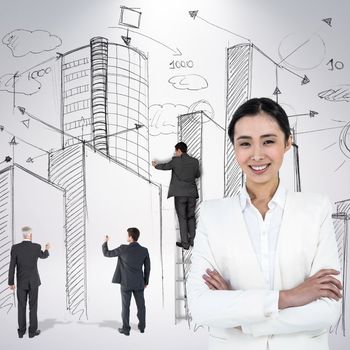 Smiling businesswoman looking at the camera against grey background