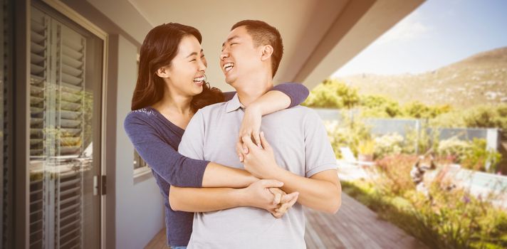 Loving woman embracing man against stylish outdoor patio area