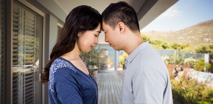 Loving couple head to head against stylish outdoor patio area