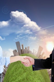 Close up of a business people closing a deal  against bright blue sky with clouds