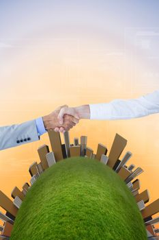 Business people shaking hands on white background against purple and orange sky