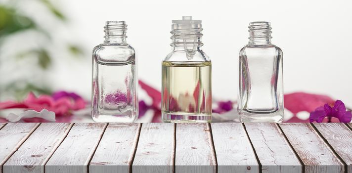 Wooden table against three glass aromatherapy jars