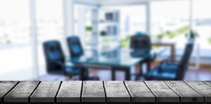 Wooden desk against board room