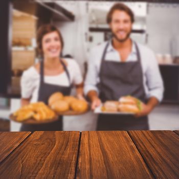 High angle view of hardwood floor against happy servers holding plates of food